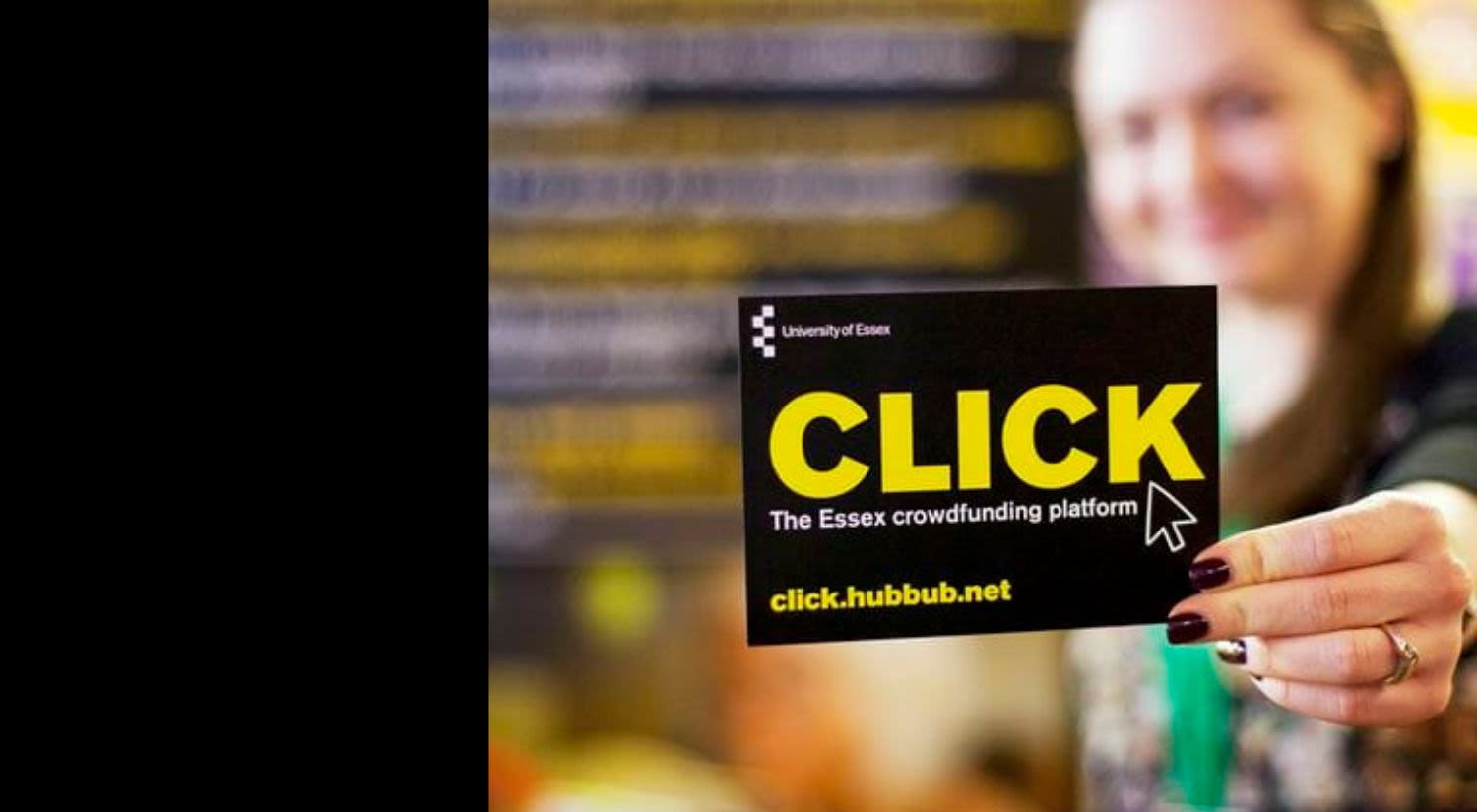 Woman holding a card saying click