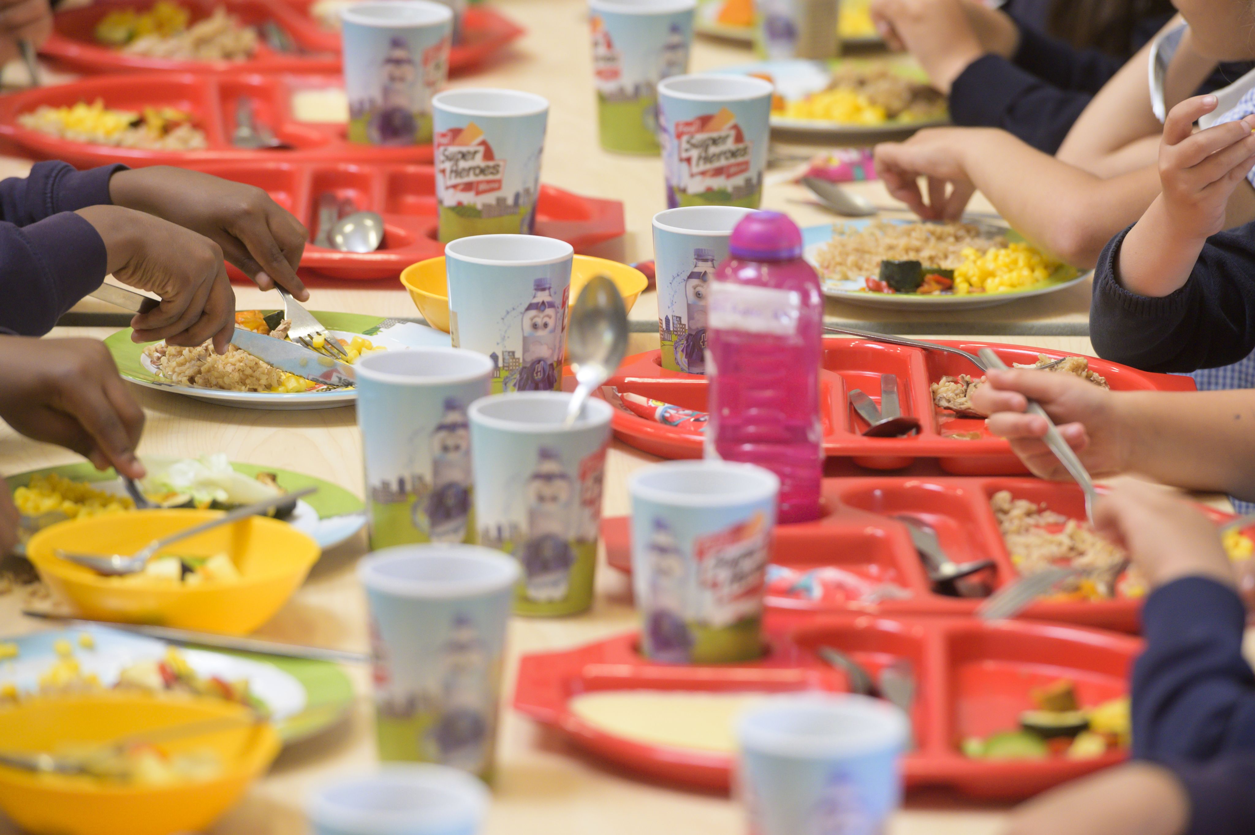 Children's drinking cups and plates on a table