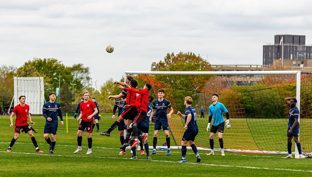 Students in the football team on goal