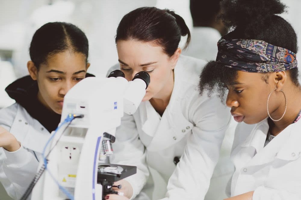 Students around a microscope