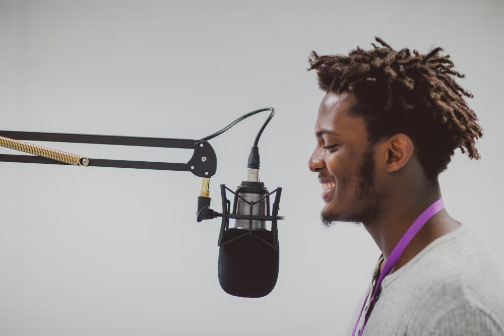 Student talking into a microphone