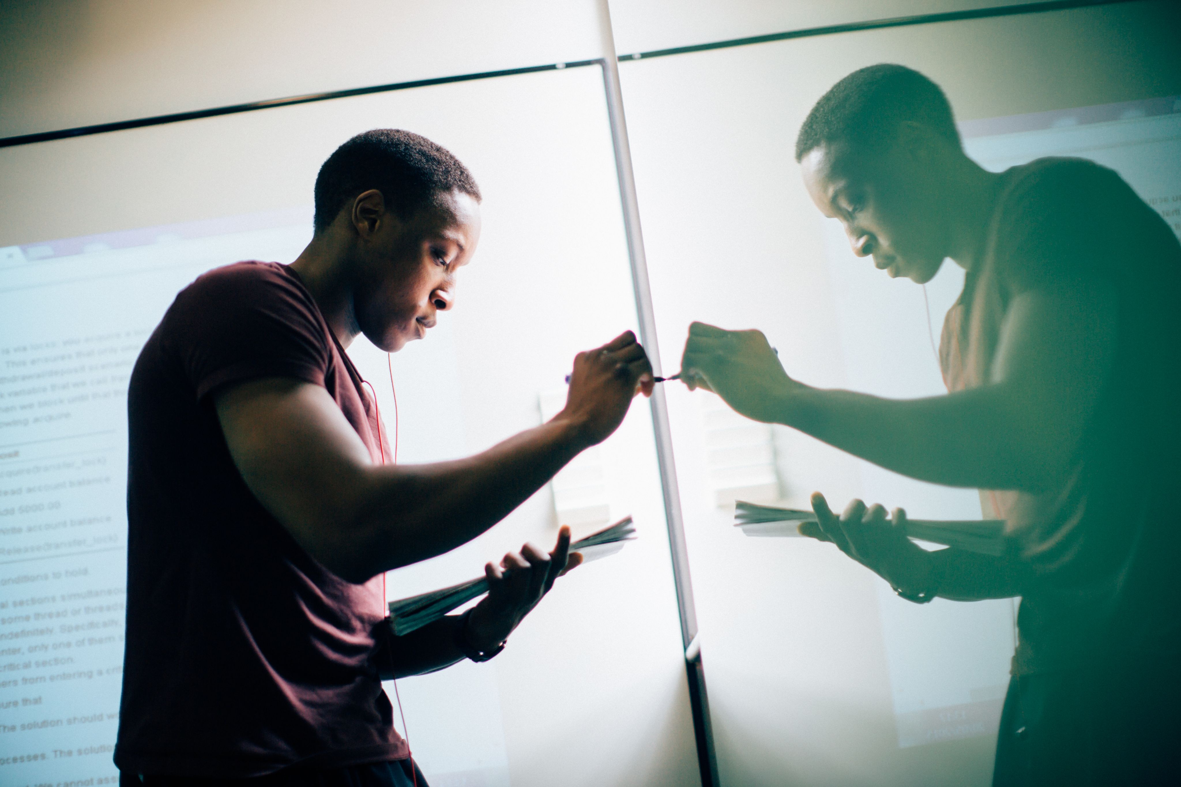 Student writing on the board