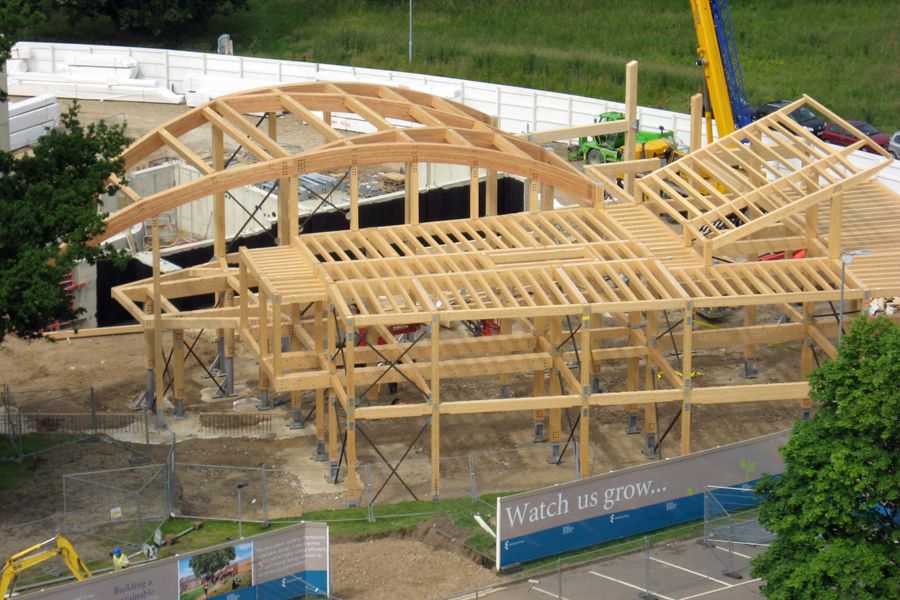 The partially-complete wooden frame of Essex Business School seen from a height.