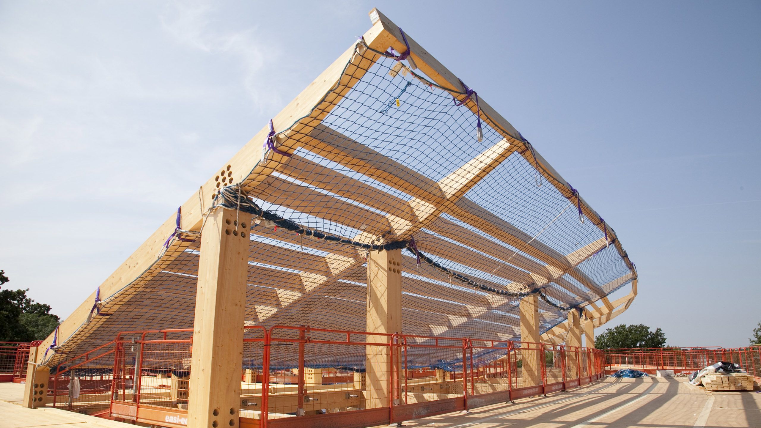 A sloping, curved wooden frame on which solar panels will later be installed.