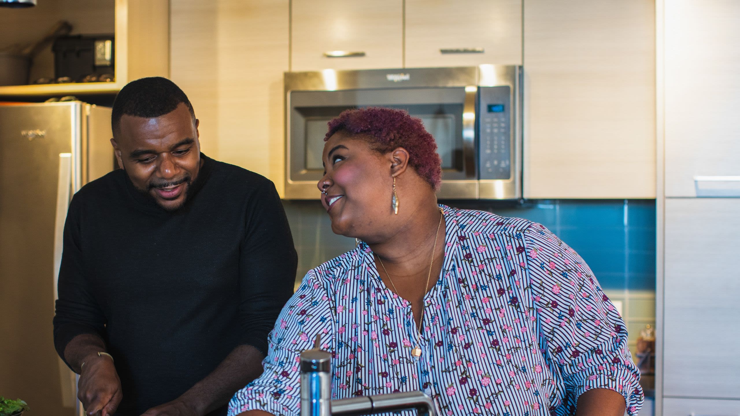 Couple chatting in a kitchen