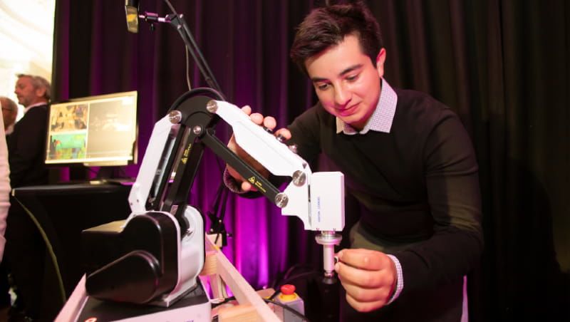 Research associate showing how machine operates