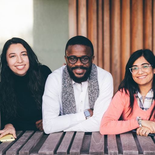 Students smiling and looking at the camera