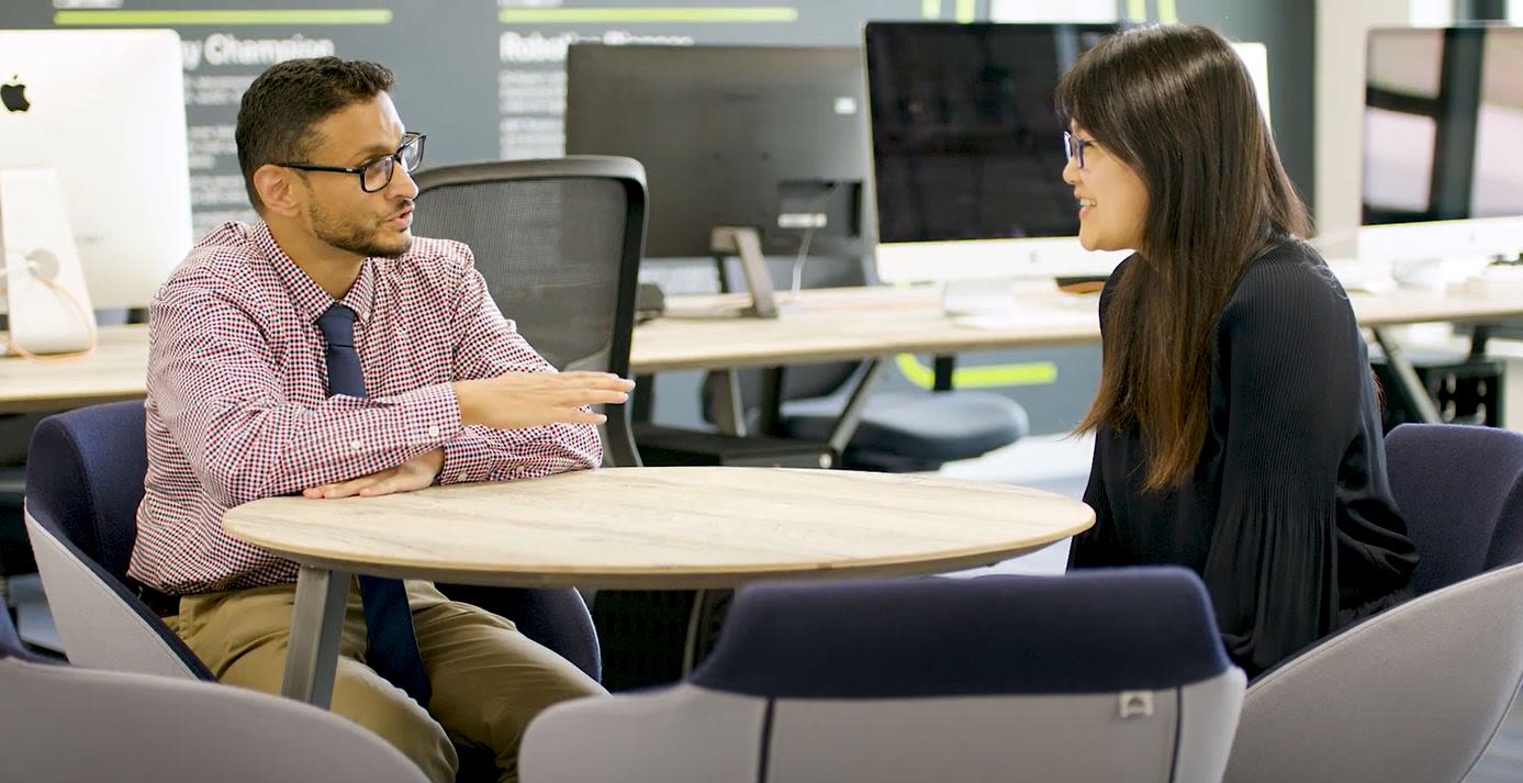 Doctor Faiyaz Doctor discusses project with colleague