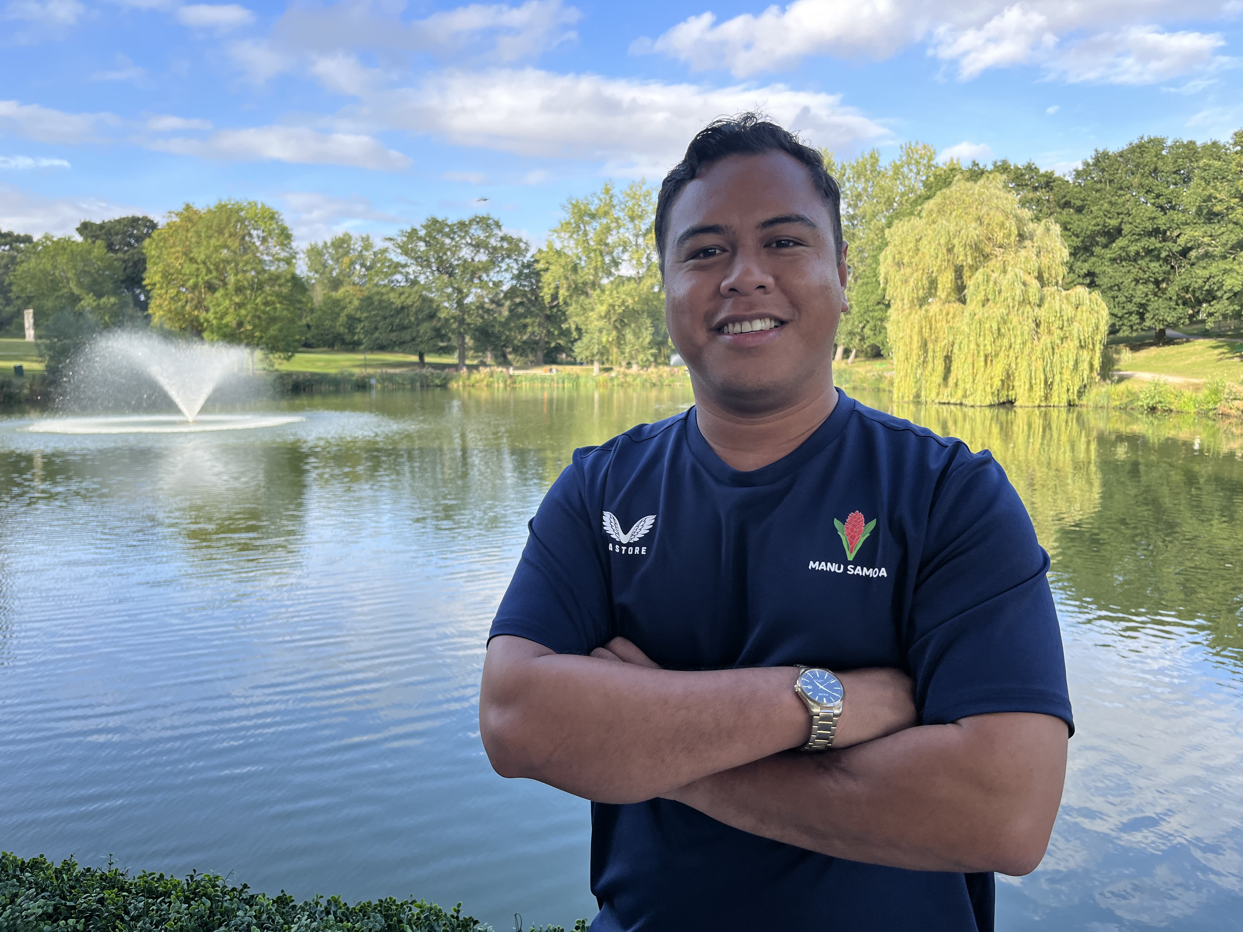 James Faiumu standing in front of the lakes on our Colchester Campus