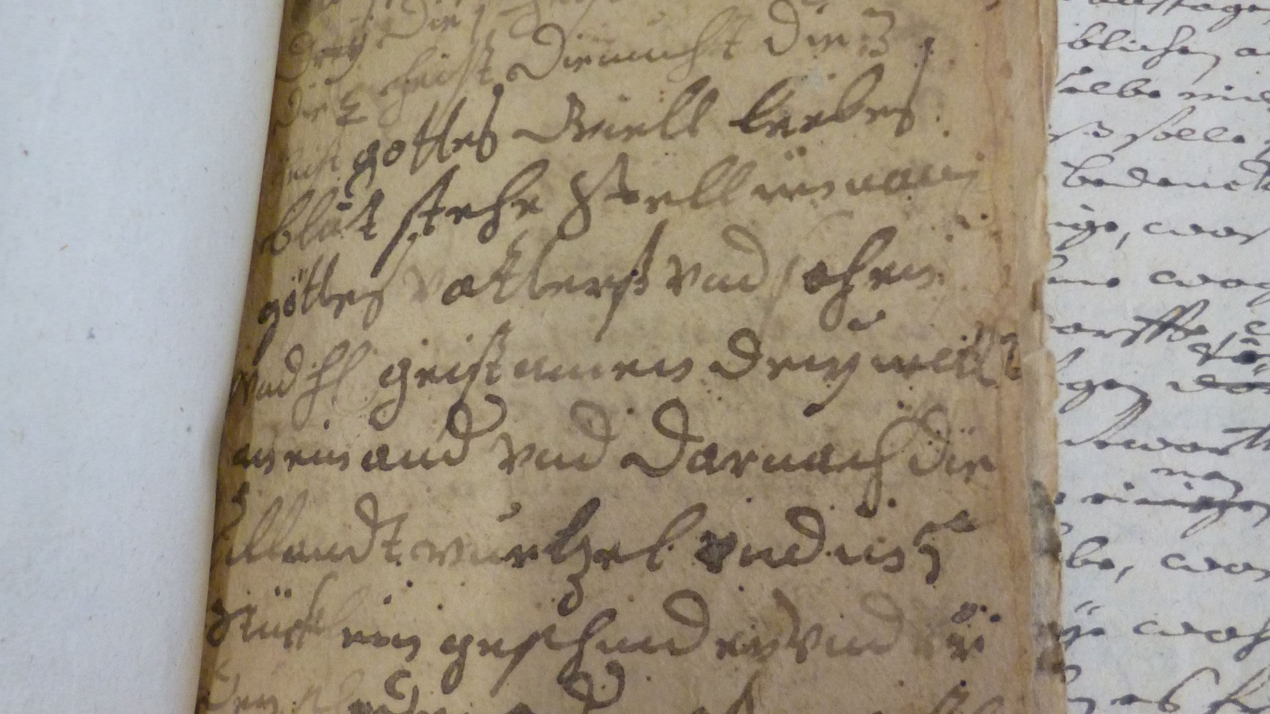 A close up of an original German written text relating to a witch trials