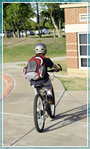 Schoolchild cycling to school