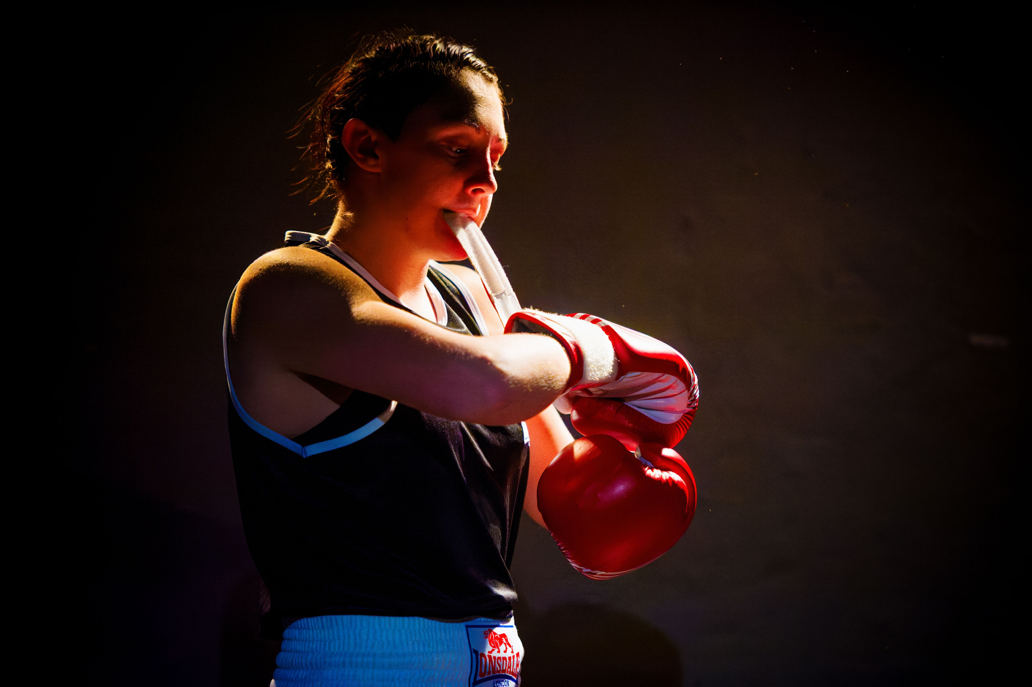 East 15 graduate Charlie Josephine, dressed as a boxer strapping up her gloves,  courtesy of Alex Brenner