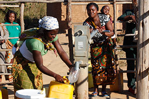 Women collecting water from a pump