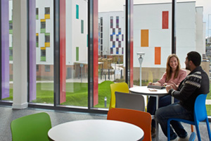 Students relax in one of the social spaces at The Meadows