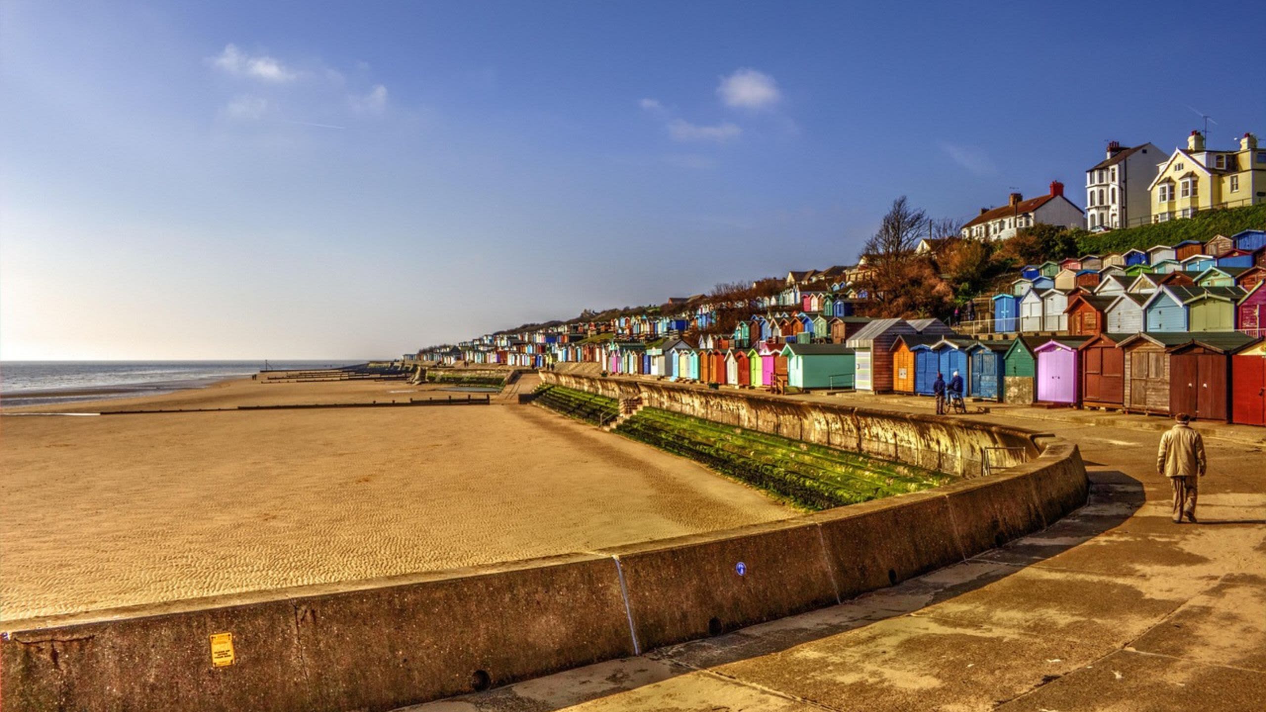 Empty beach with beach huts in Essex