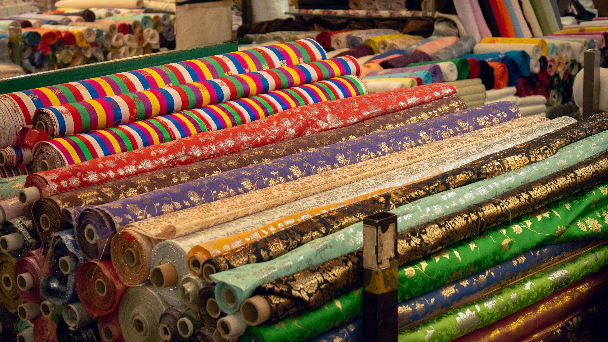 Large reels of colourful fabric